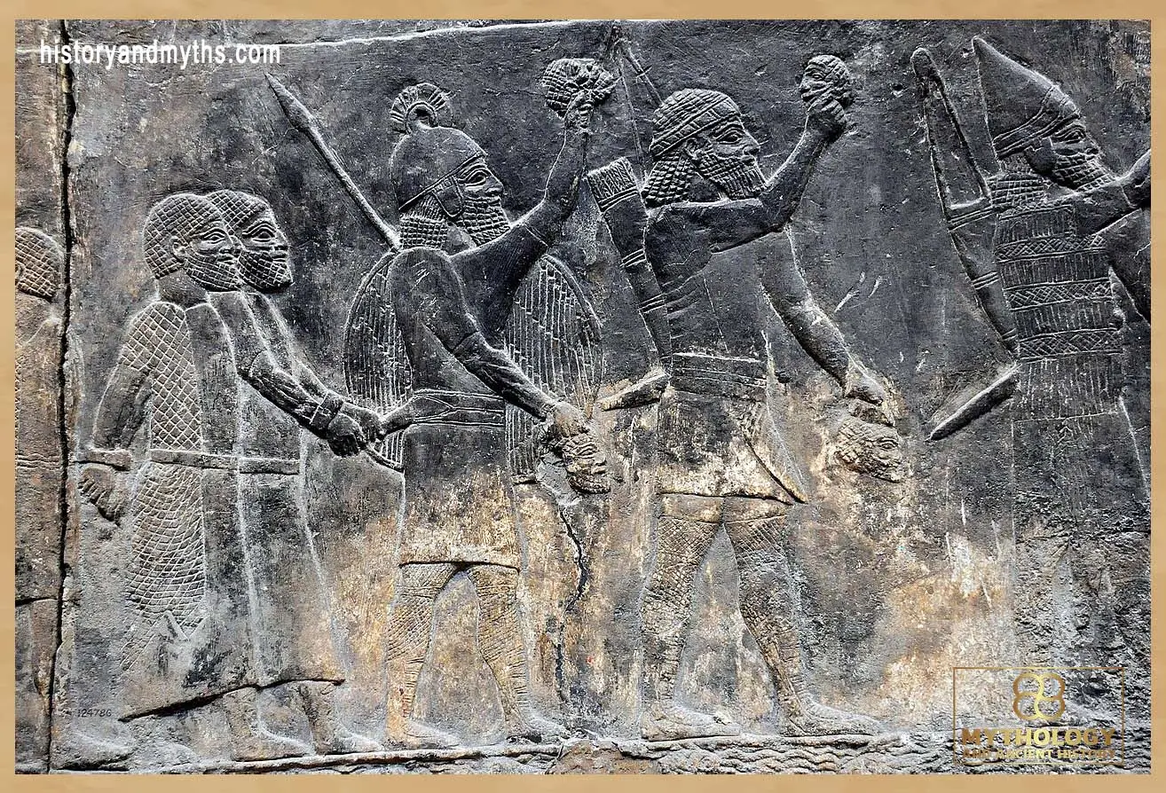 Relief showing Assyrian soldiers displaying the heads of defeated enemies, illustrating how imperial violence was transformed into visual propaganda under Sennacherib.
