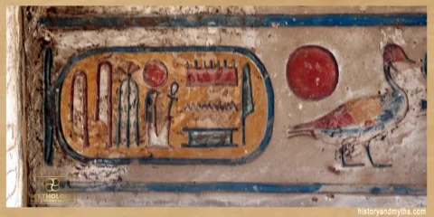 Painted cartouche and solar disk on the ceiling of the Great Hypostyle Hall in Karnak Temple, Luxor, showing hieroglyphic symbols associated with the sun god Ra