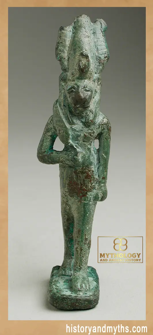 Bronze figurine of a lion-headed deity holding a knife