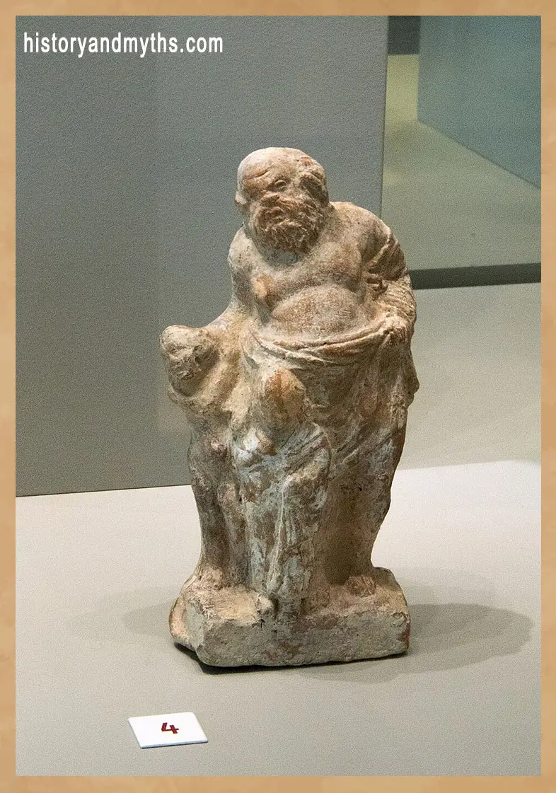Paidagogos with two boys from Tanagra, 4th century BC, illustrating supervision and discipline in Ancient Greek schools