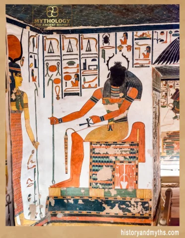 Khepri depicted as a scarab-headed deity seated on a vibrant throne in the Tomb of Nefertari
