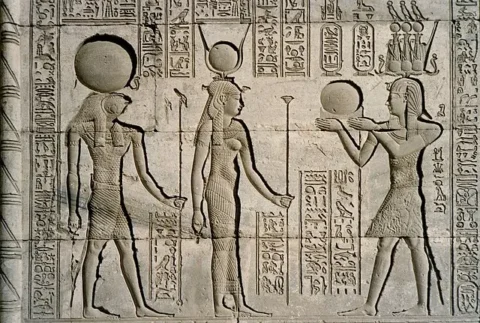Relief at Dendera Temple showing Traianus (right), Horus (left), and Hathor (center), Dendera, Egypt