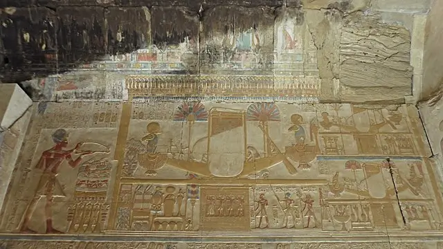 he king burns incense in front of the festival barque of Amun. Behind that are the barques of Khonsu (upper right) and Mut (lower right)