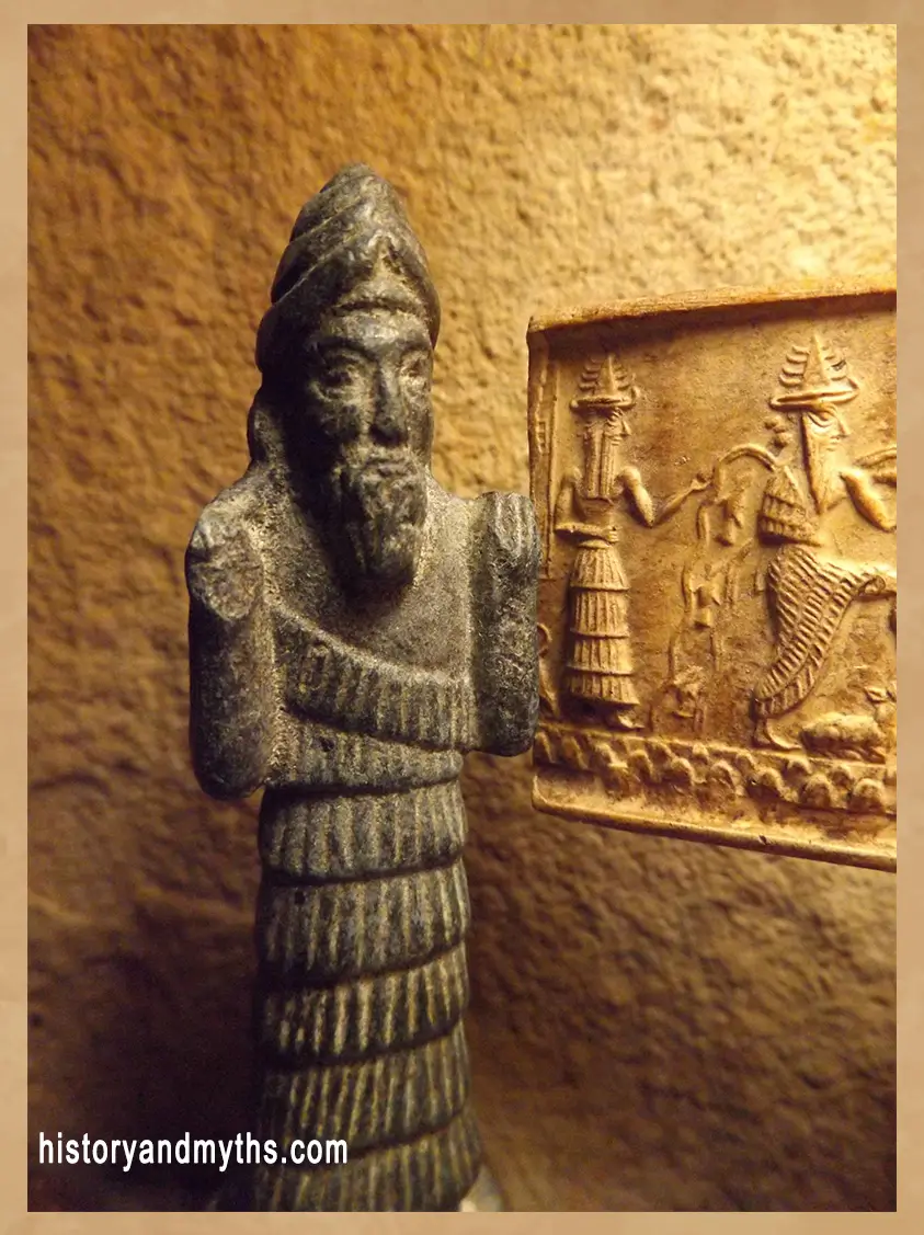 Enki statue artifact with another Enki artifact on the wall