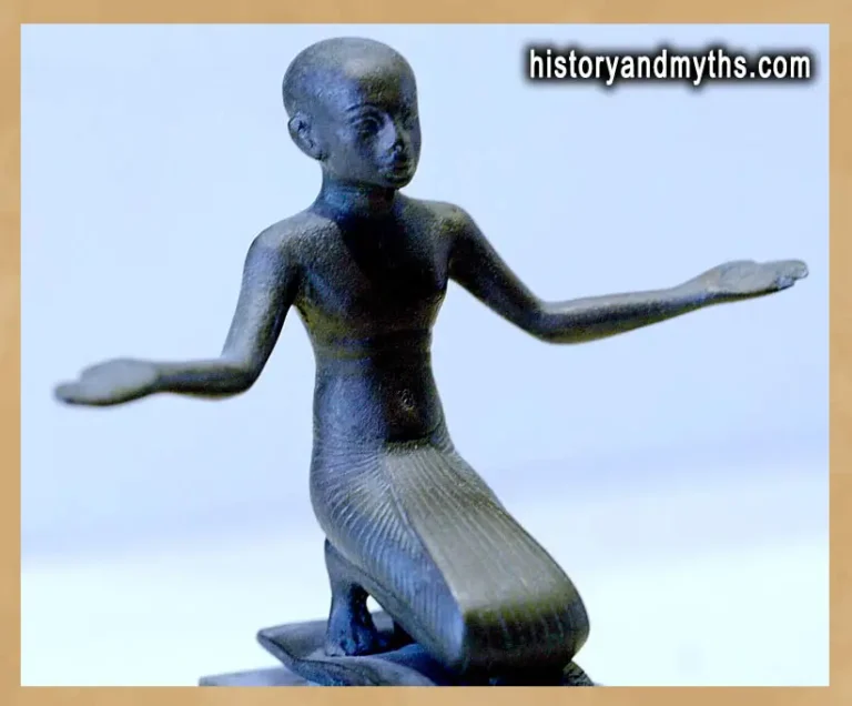 Bronze figurine of a praying man from ancient Egypt in the Louvre Museum